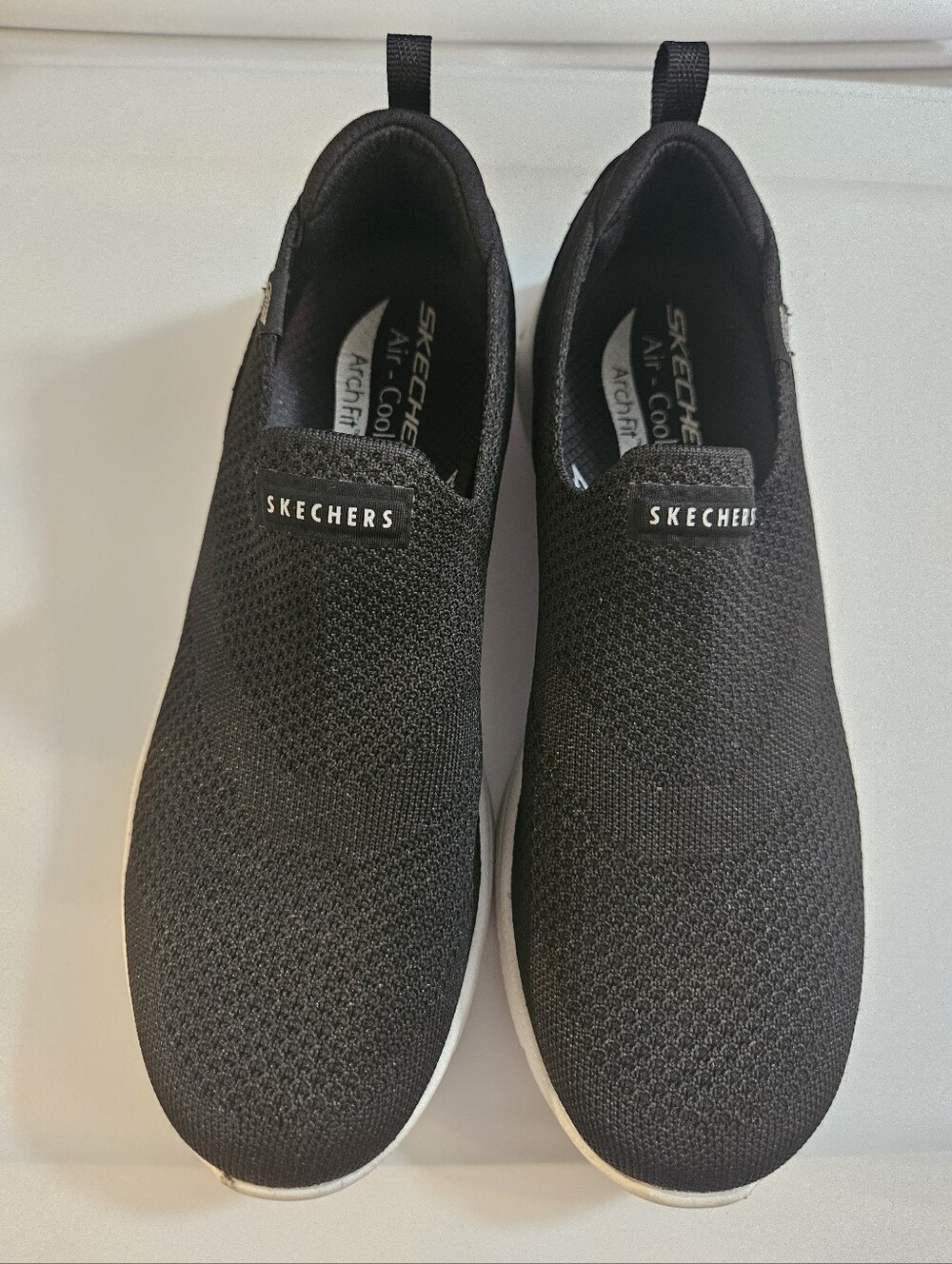Skechers Black Slip-On Knit Sneakers with White Sole - Picture 1 of 10